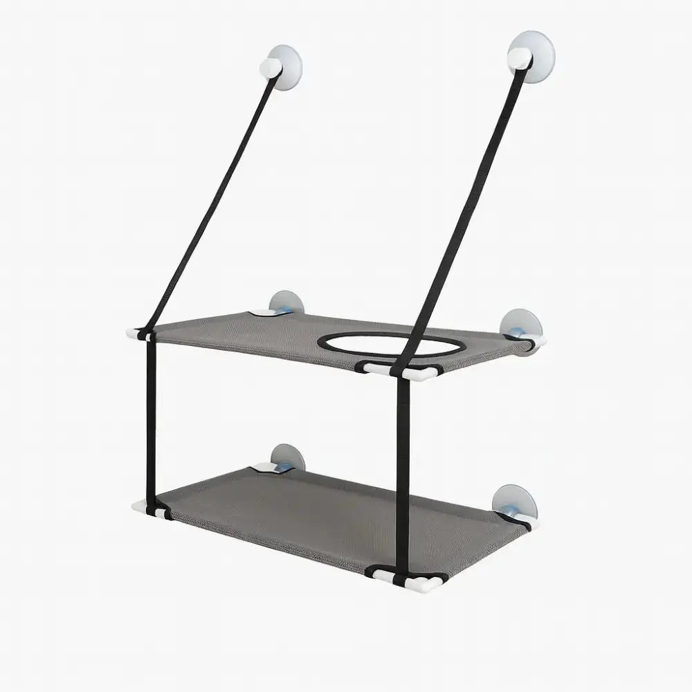 Hamac de fenêtre pour chat à double niveau gris, fixé par ventouses solides, offrant un espace de repos et d’observation en hauteur.