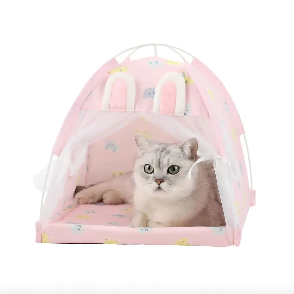 Tente pour chat rose avec oreilles de lapin, dotée d’un coussin moelleux et de rideaux en tulle, idéale comme panier confortable pour intérieur ou extérieur.